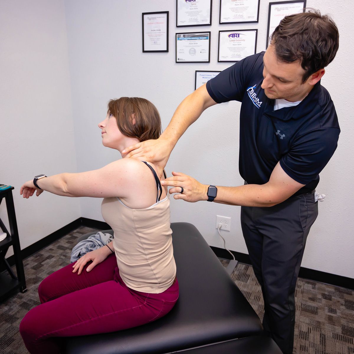 chiropractor using active release techniques on shoulder muscles