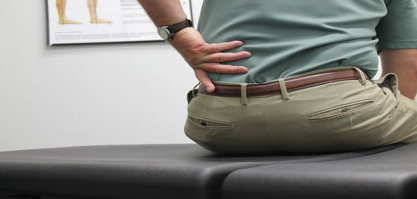 patient experiencing lower back pain